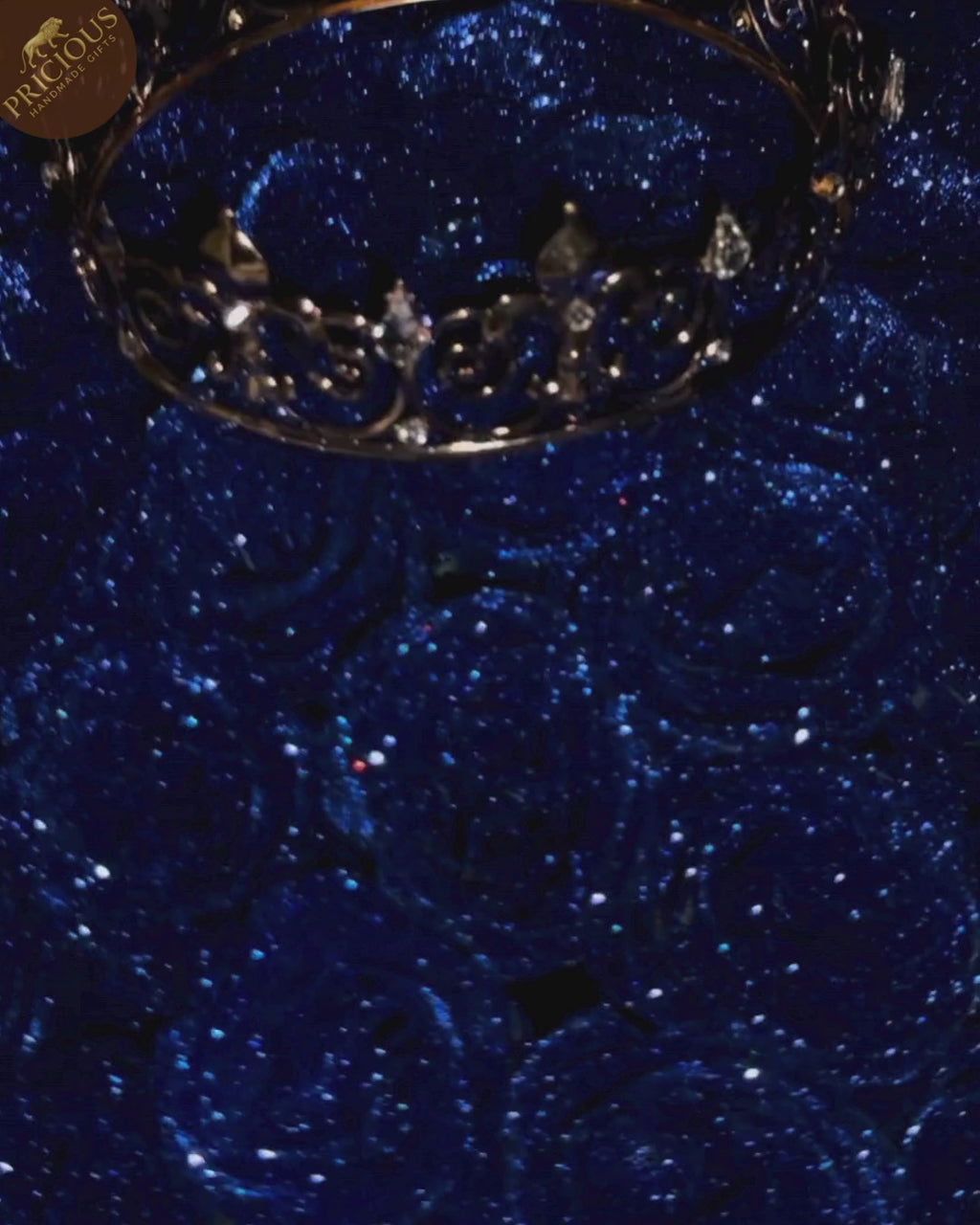 Royal blue glitter rose hand-tied bouquet with king crown in black and gold wrap