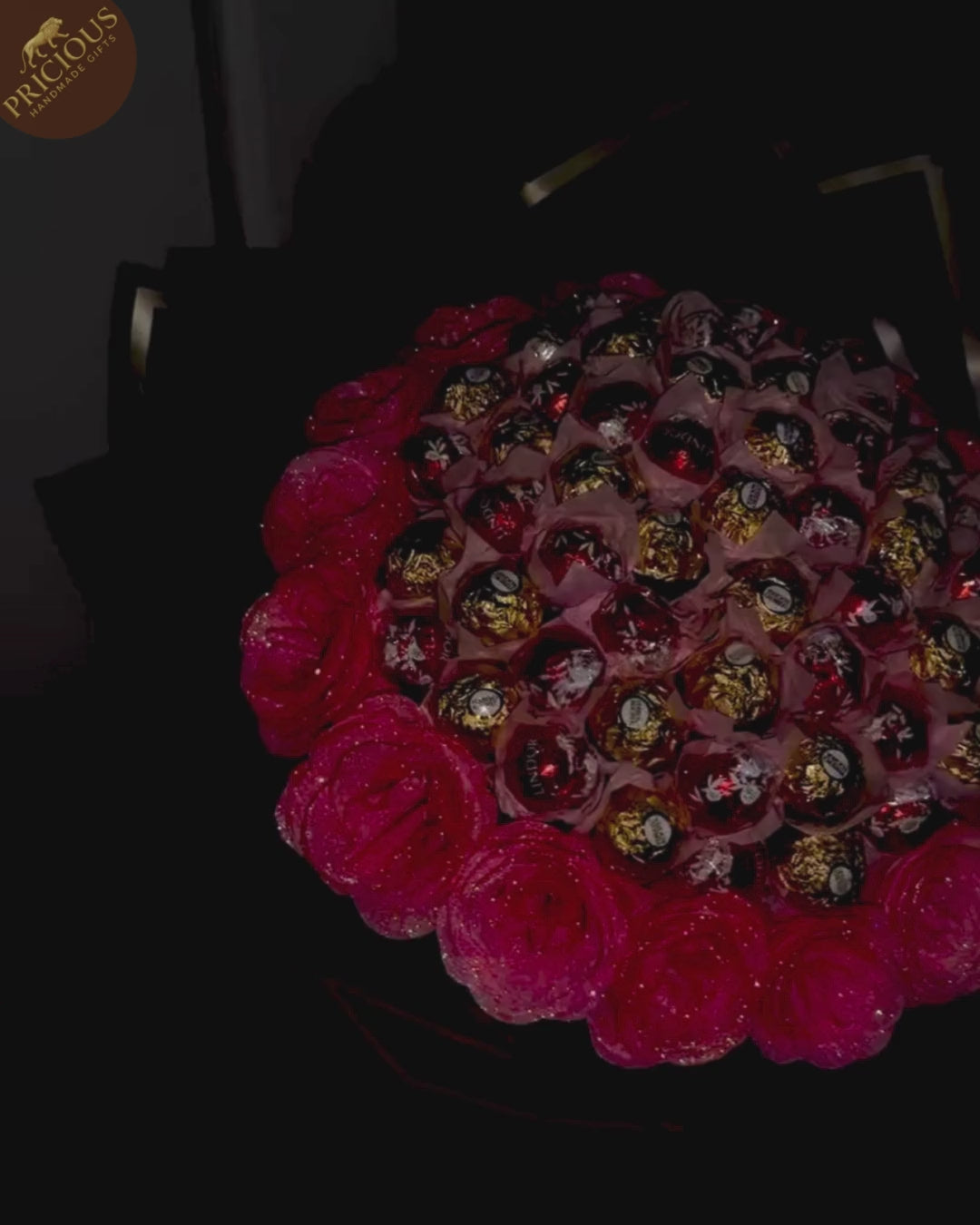 Video of mixed-brand chocolate bouquet with glitter roses and black & gold wrap, handmade in the UK.