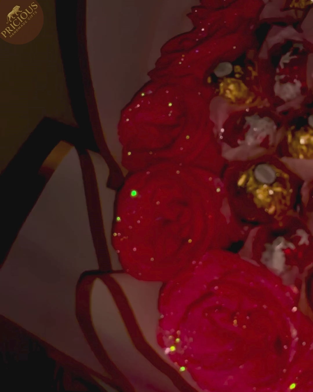 Top-down view of mixed truffles arranged with hand-tied artificial roses.