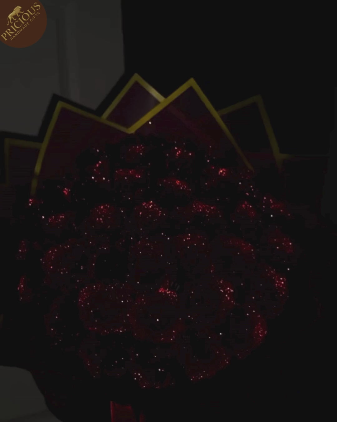 Top-down view of the artificial roses bouquet showing the central dome and neat hand-tied layers.