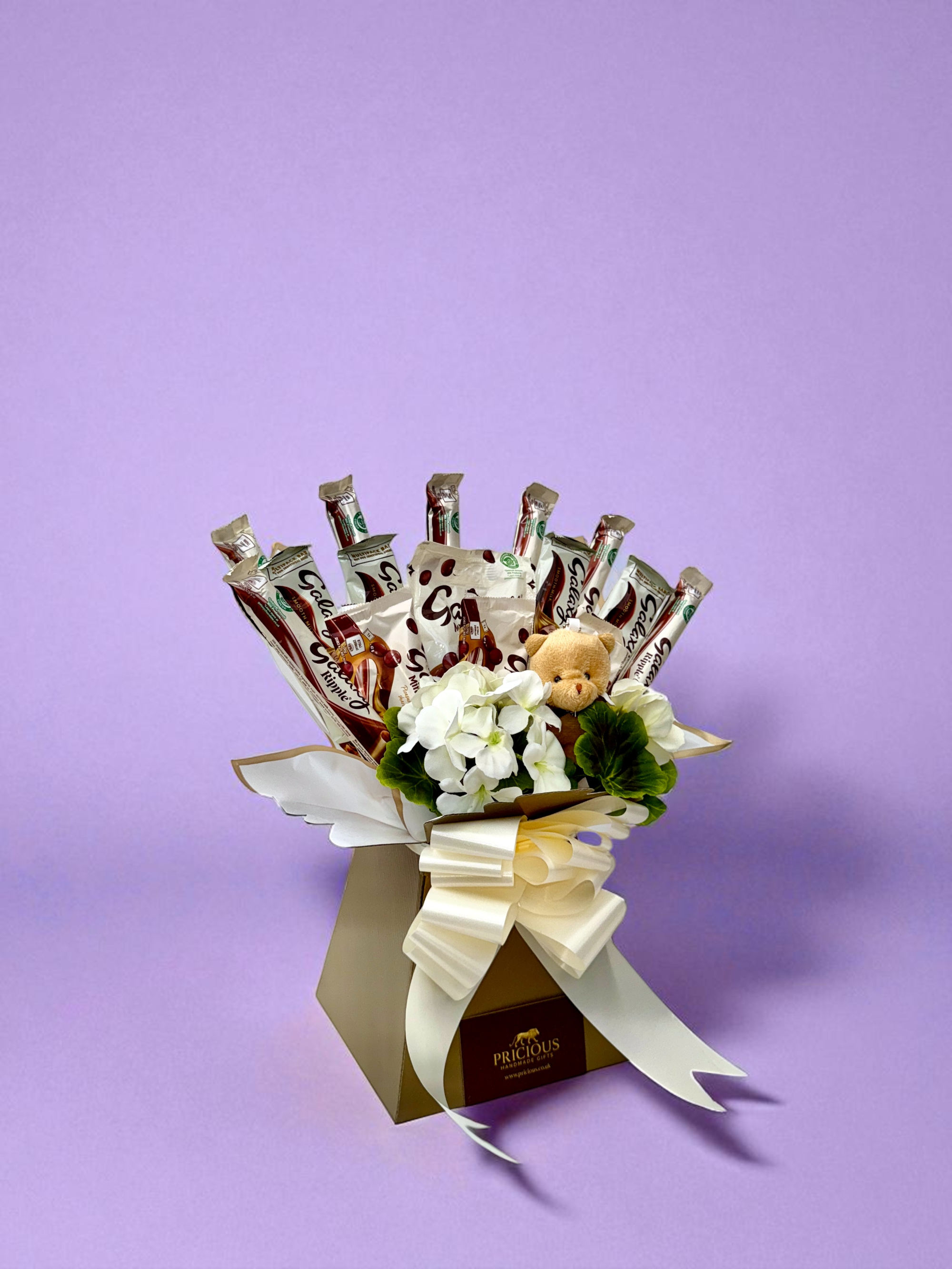 Side view luxury ivory and gold Galaxy chocolate gift bouquet with teddy